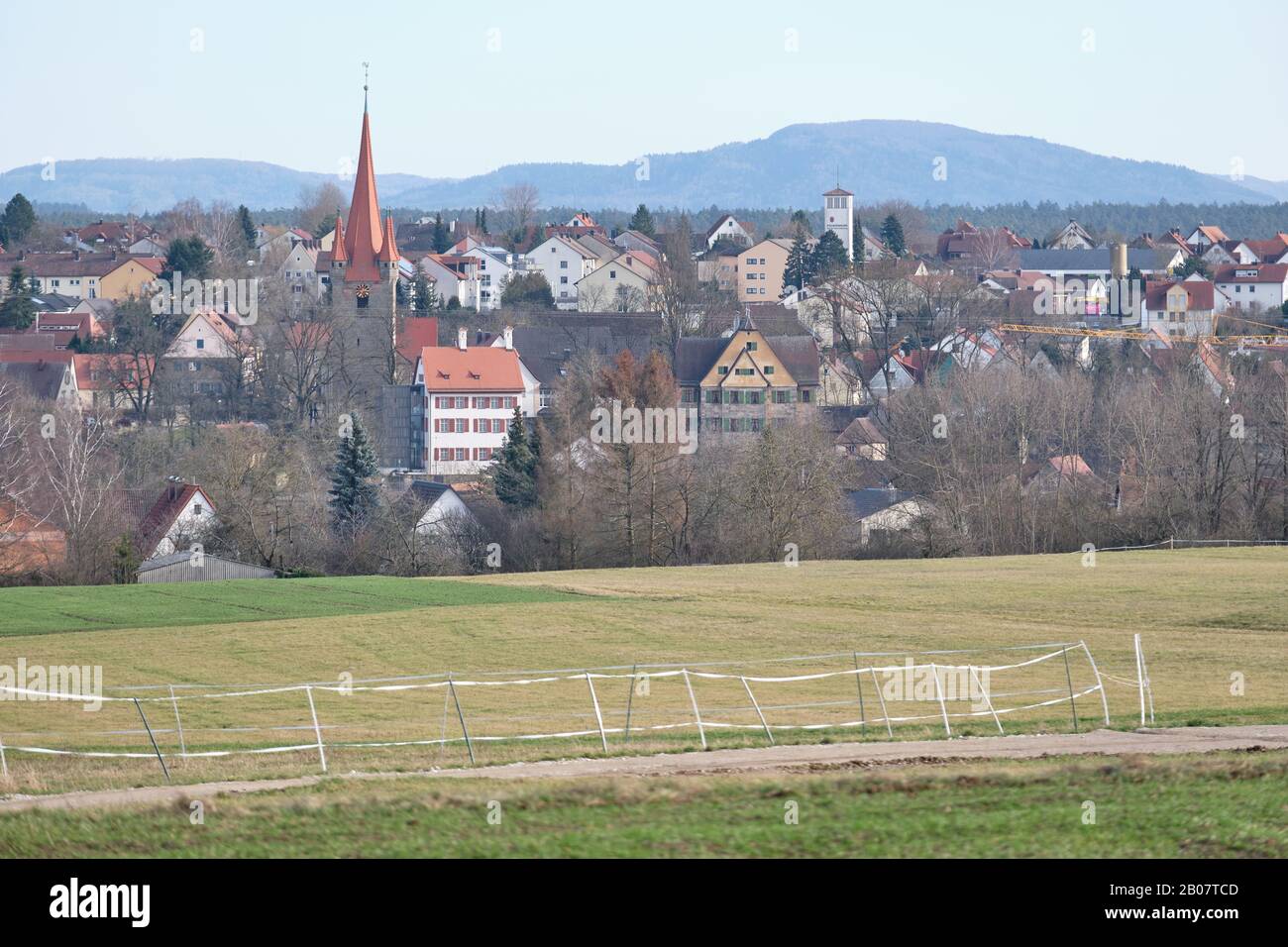February landscape with the german town Heroldsberg with the St.- Matthäus church and the hill called Moritzberg in the background. Stock Photo
