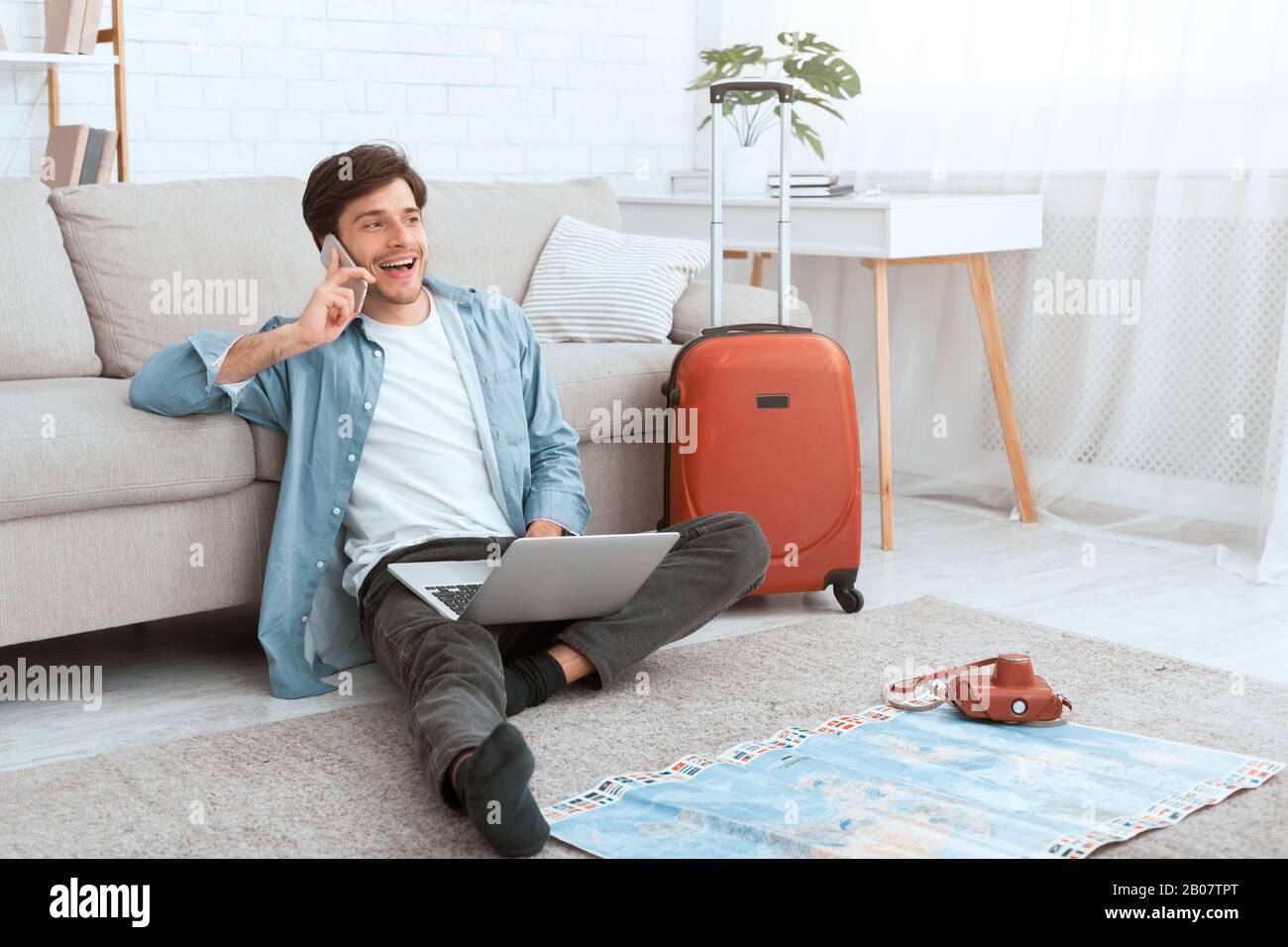 Consulting with travel agent. Man preparing for vacation Stock Photo