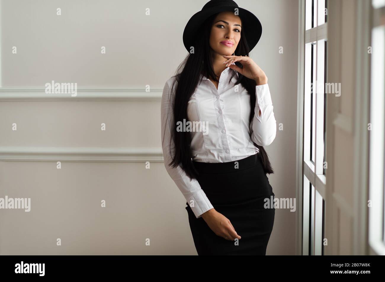 Business woman in suit hat hi-res stock photography and images - Alamy