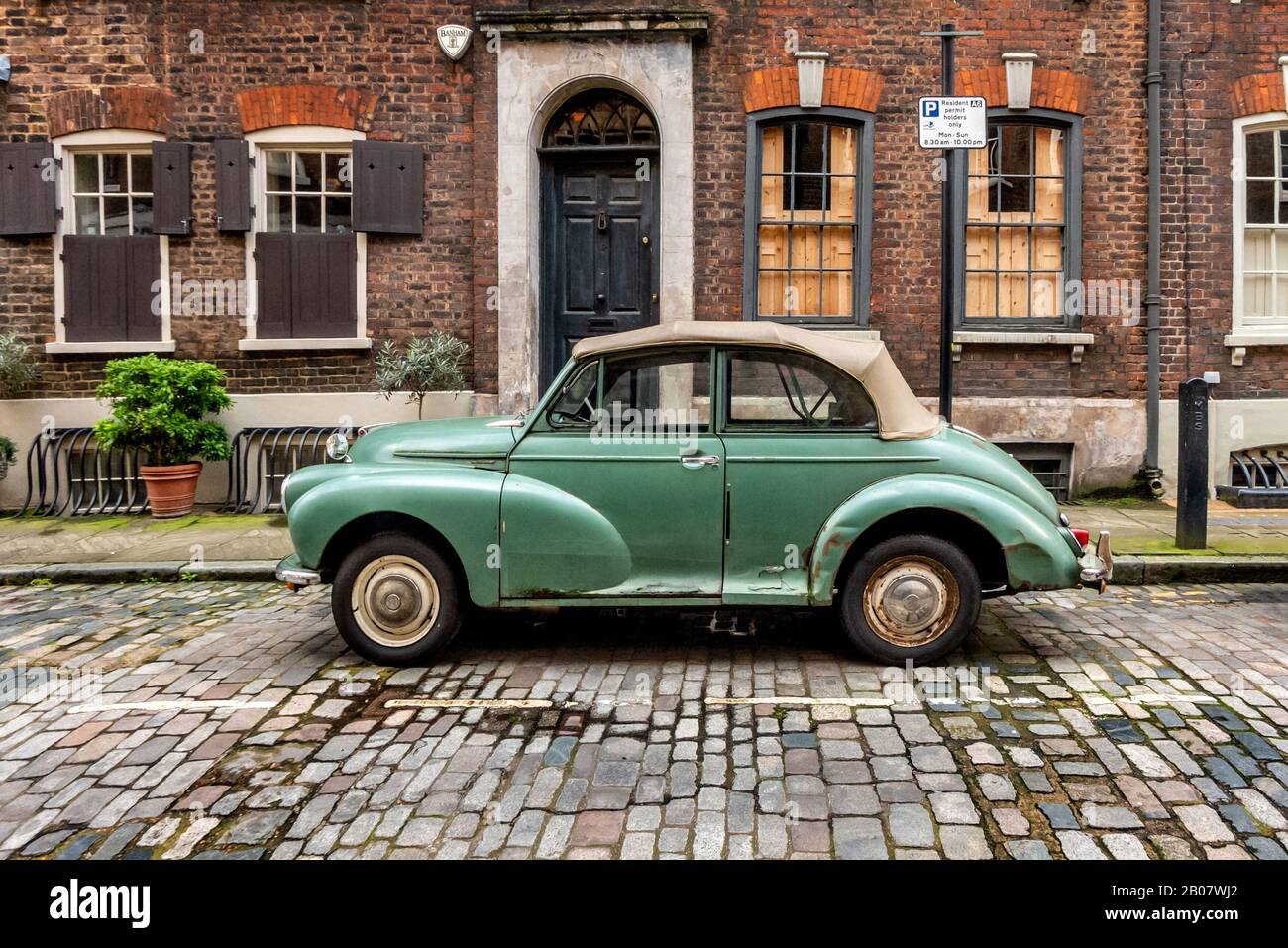 A convertible Morris Minor in the East end of London Stock Photo