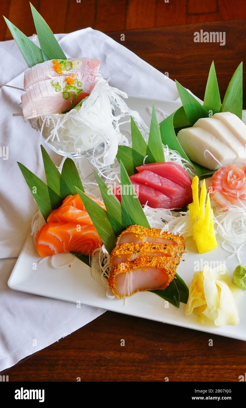 A plate of raw fish sashimi at a Japanese restaurant Stock Photo - Alamy