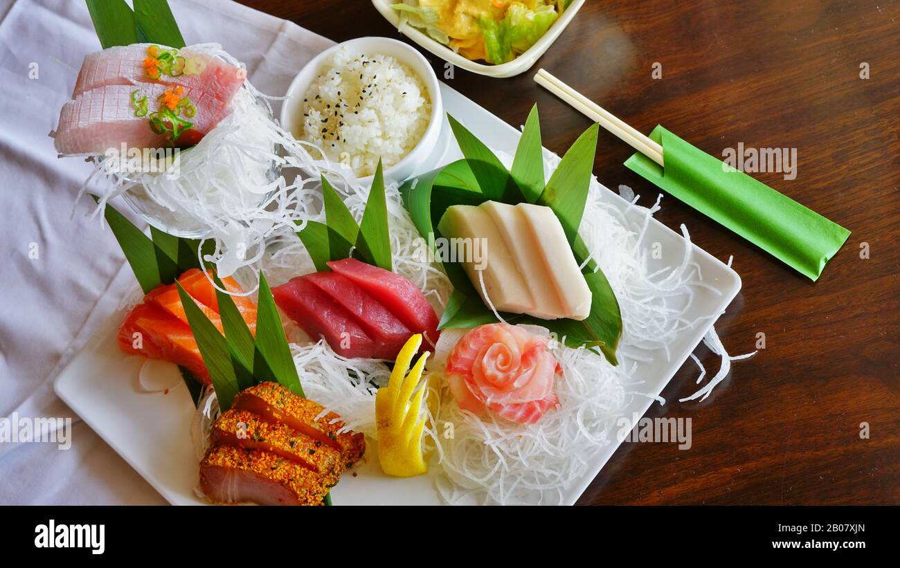 A plate of raw fish sashimi at a Japanese restaurant Stock Photo - Alamy