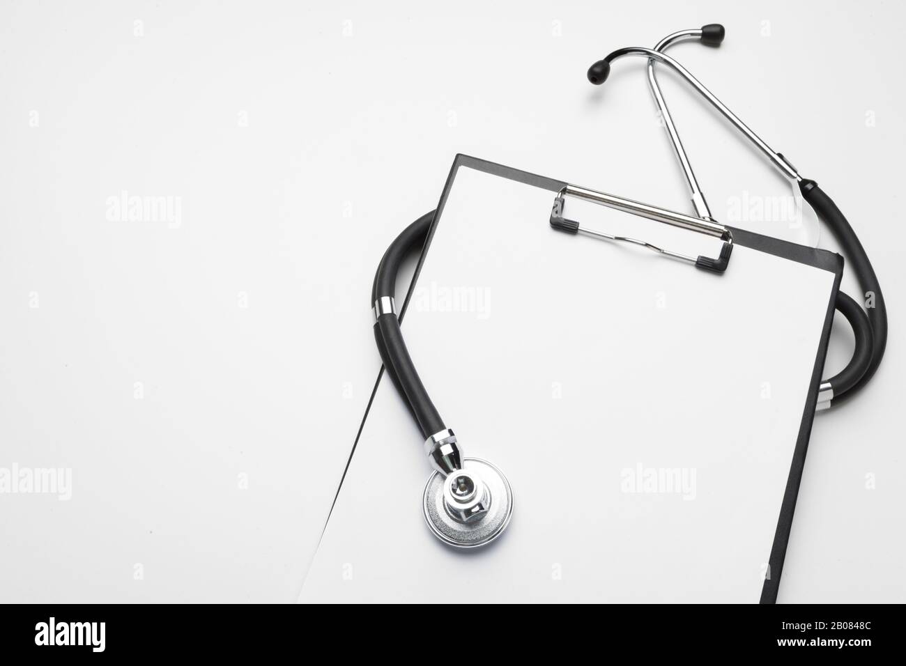 Blank medical clipboard with stethoscope on white background Stock ...