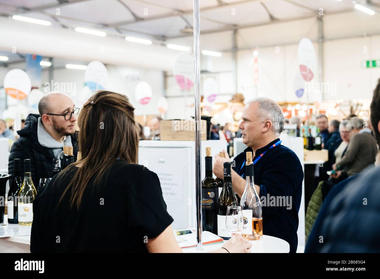 Strasbourg, France - Feb 16, 2020: people tasting French wine at the Vignerons independant English: Independent winemakers of France wine fair for private and horeca customers Stock Photo