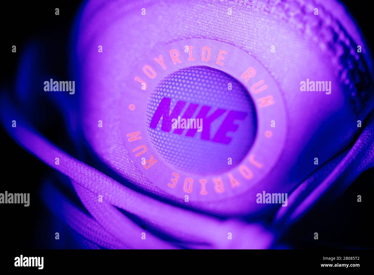 Paris, France - Jul 30, 2019: Close-up of NIke Joyride logotype on the front of latest innovation the Joyride running shoes with thousands of tiny beads for better support - neon modern colors Stock Photo