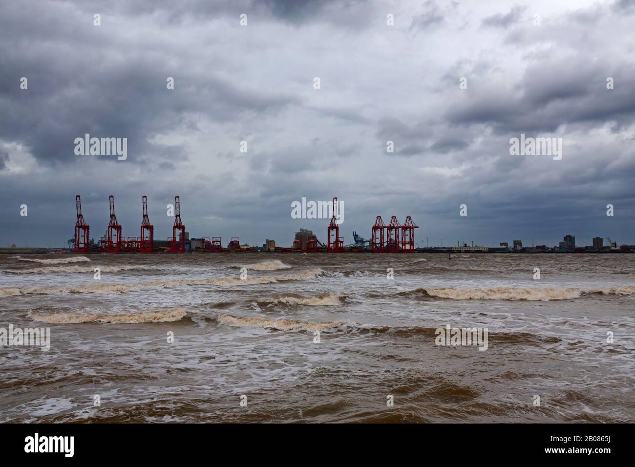 Looking across the River Mersey on a stormy day towards Liverpool 2 docks from New Brighton Wallasey UK Stock Photo