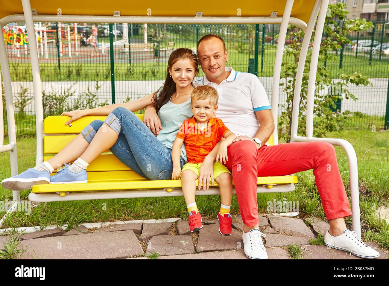 outdoor portrait of a happy family. Mom, dad and child Stock Photo - Alamy
