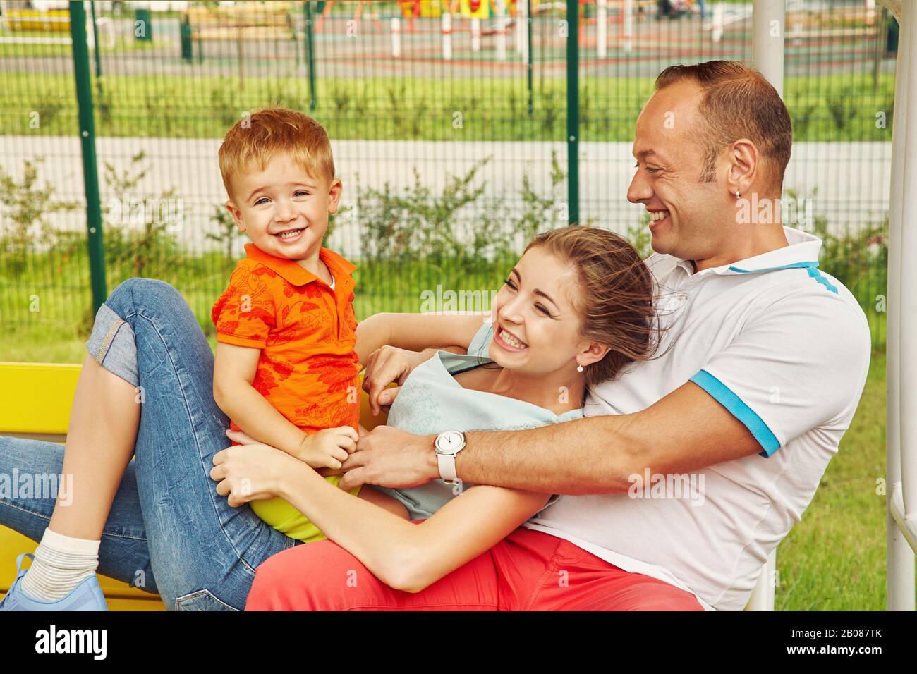 outdoor portrait of a happy family. Mom, dad and child Stock Photo - Alamy