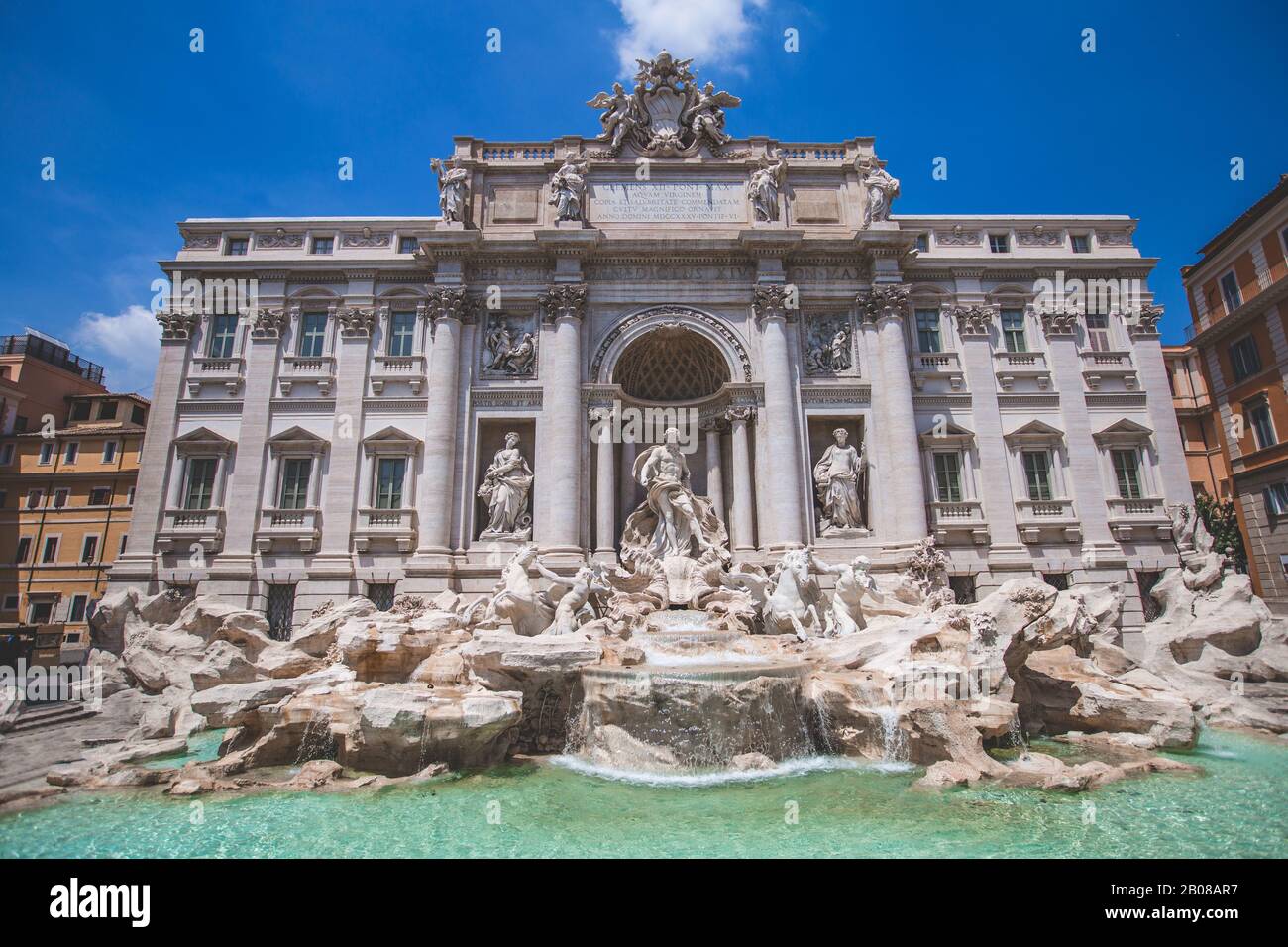 Daytime front view photo of the Trevi Fountain (Fontana di Trevi) in