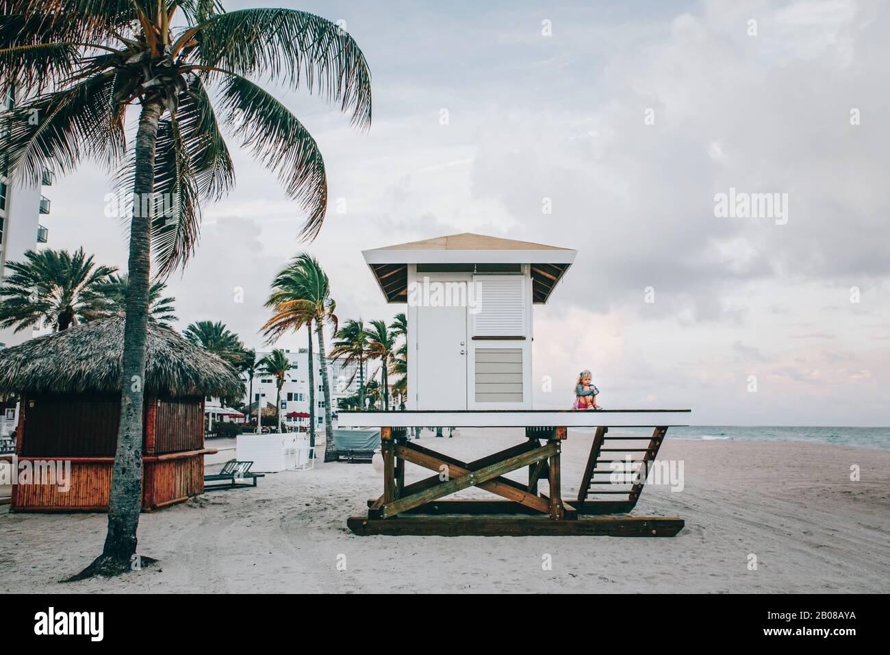 Lonely Sad Child Girl Sitting At Lifeguard House On Beach Upset Cute Kid Alone At Sea Ocean Shore Problems Troubles Of Childhood Growing Up Travel Stock Photo Alamy