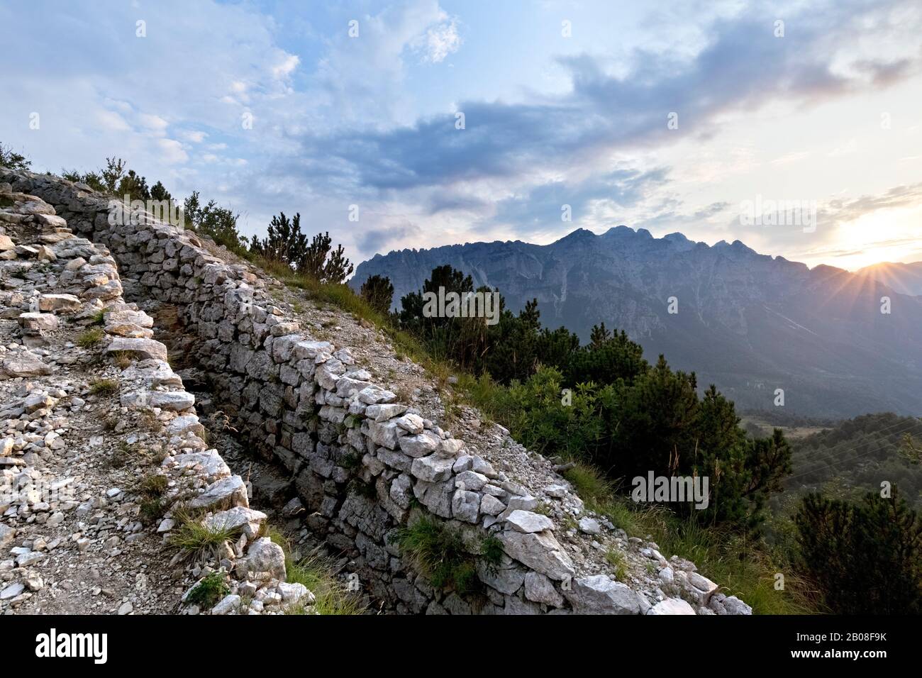 Italian trench of the Great War at the top of Mount La Sisilla. In the background the Carega ridge. Piccole Dolomiti, Veneto, Italy. Stock Photo