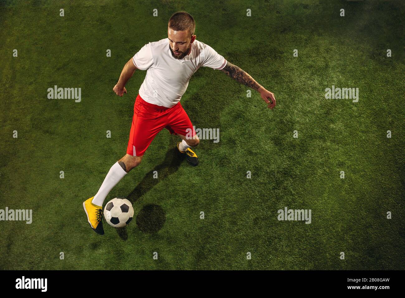 Football Soccer Player is Number One in a Stadium Background Stock