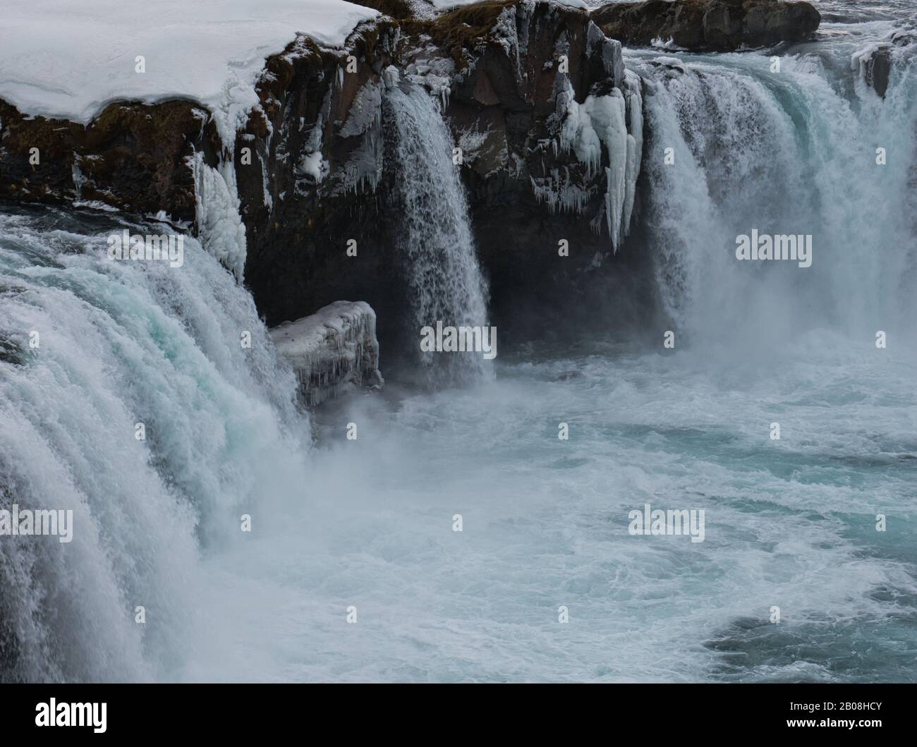 A close-up of the Godafoss Waterfall in Iceland with snow and ice Stock Photo