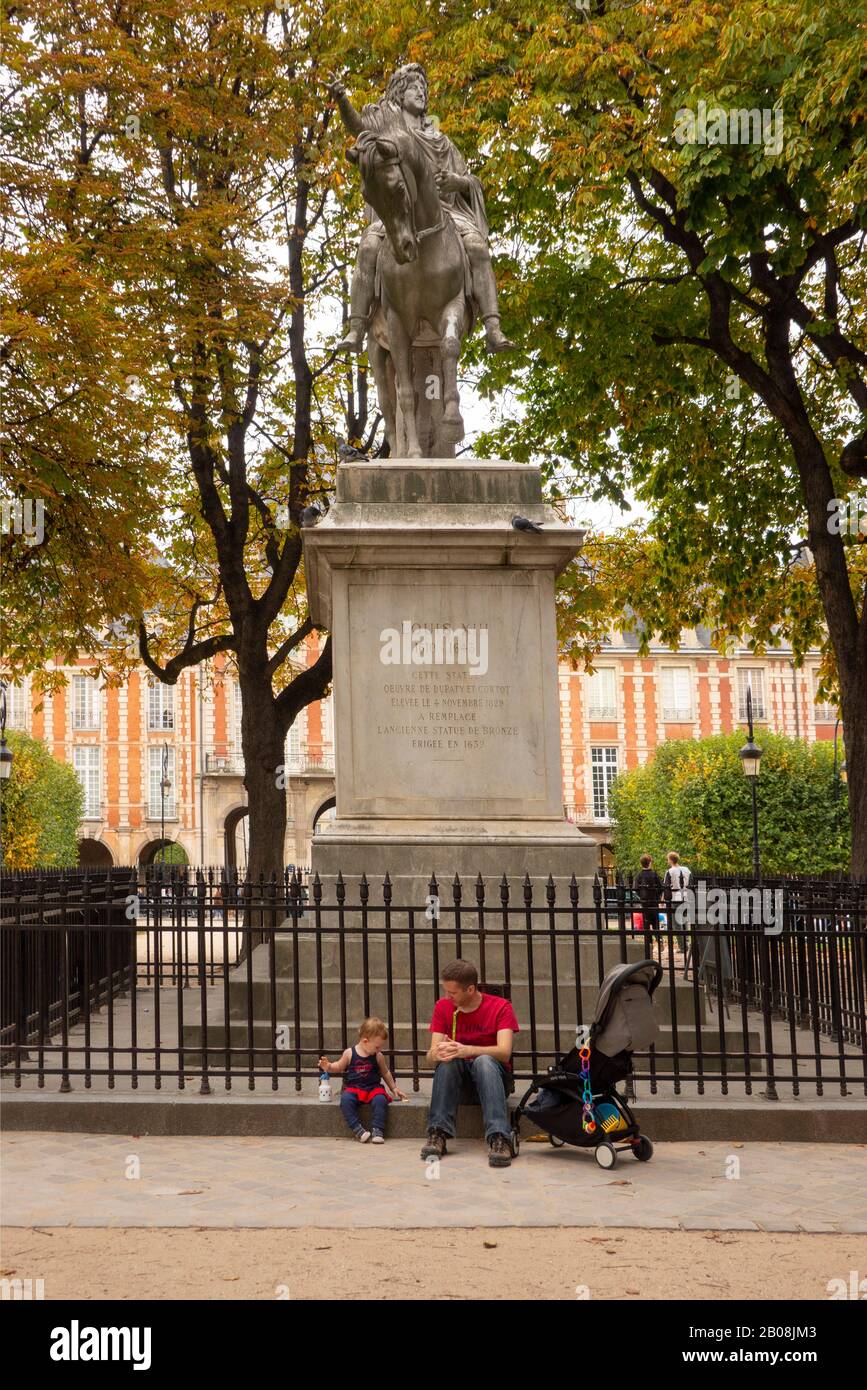 Place des Vosges park Marais district Paris France Stock Photo