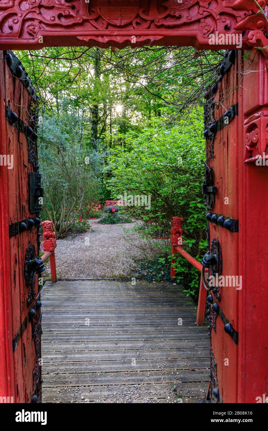 France, Indre et Loire, Loire Valley listed as World Heritage by UNESCO, Amboise, Pagode de Chantaloup, red door to the Anglo-Chinese garden // France Stock Photo