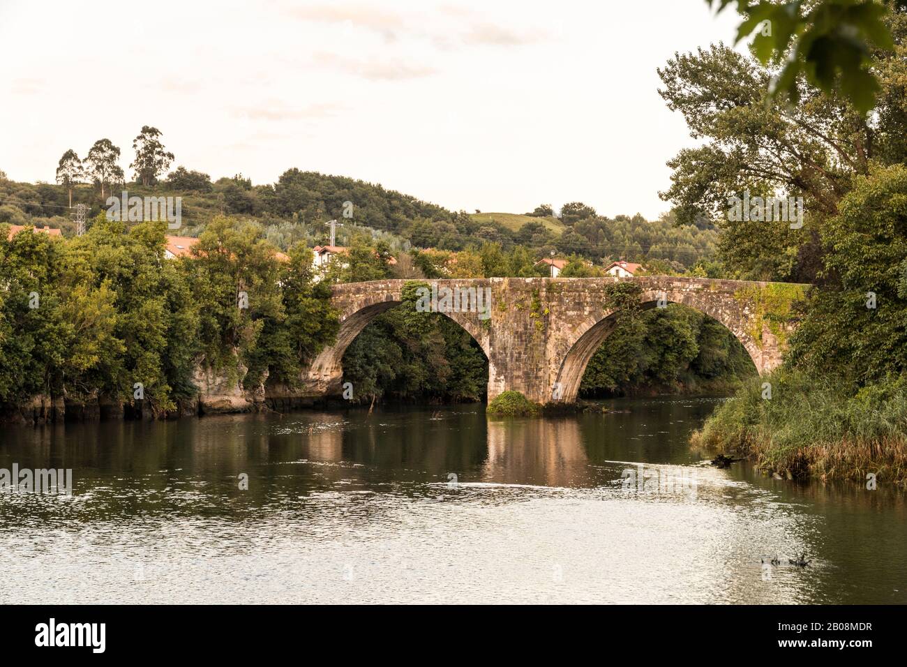 Oruna de Pielagos, Spain. The Puente Viejo (Old Bridge) over the river Pas in Cantabria Stock Photo