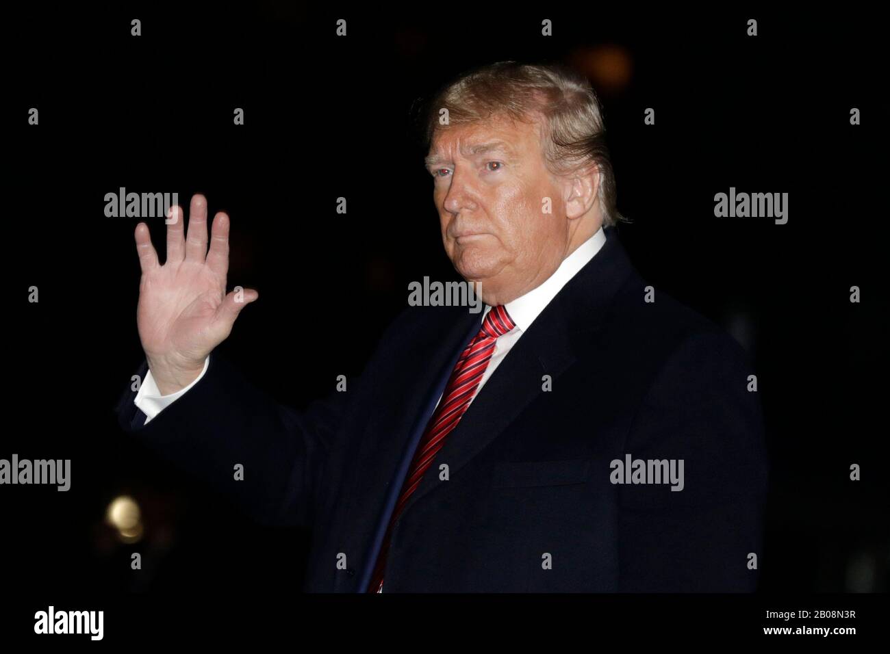 United States President Donald J. Trump waves as he walks on the South ...