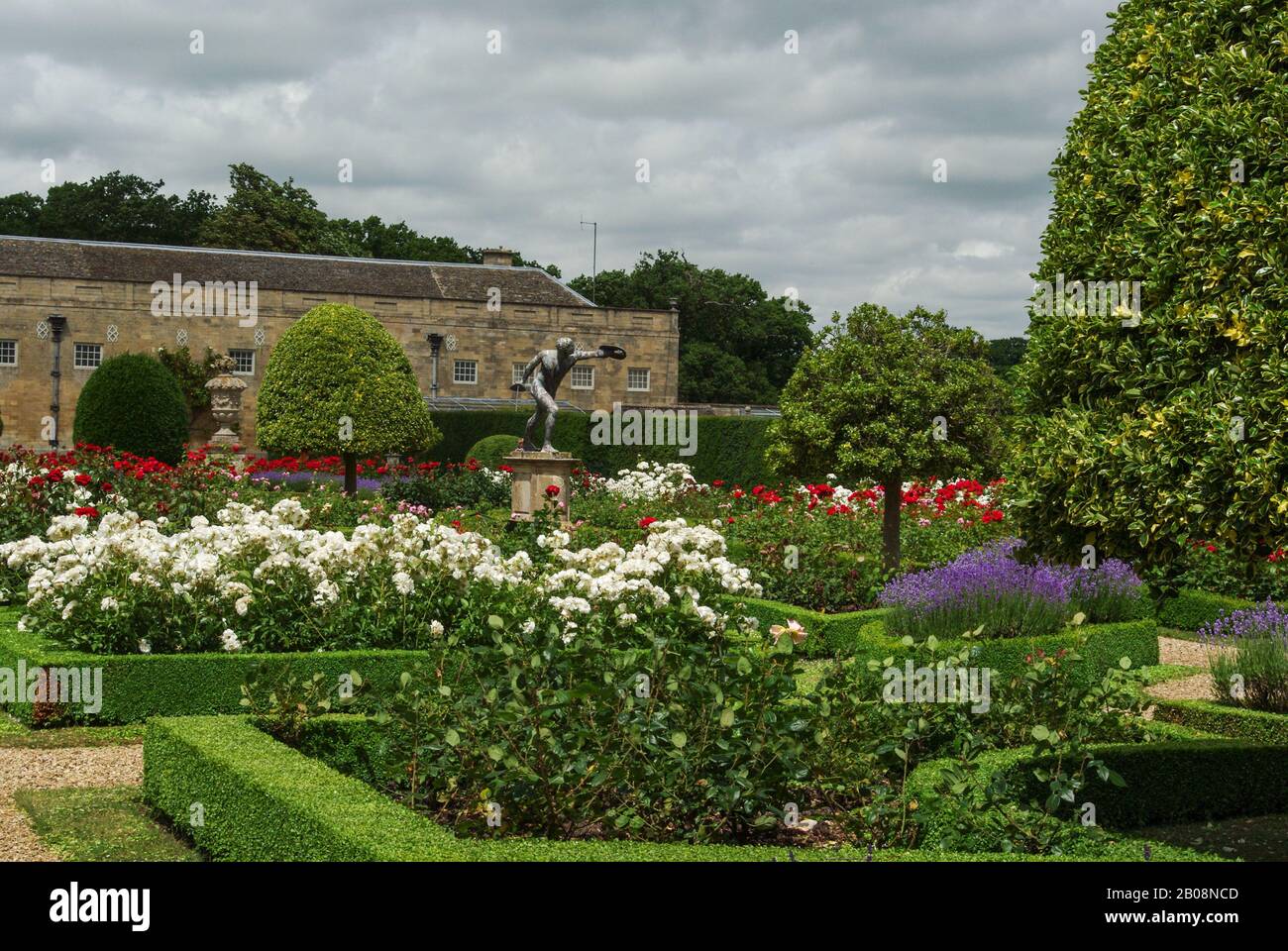 A formal English garden in Summer at Grimsthorpe Castle, Lincolnshire, UK Stock Photo