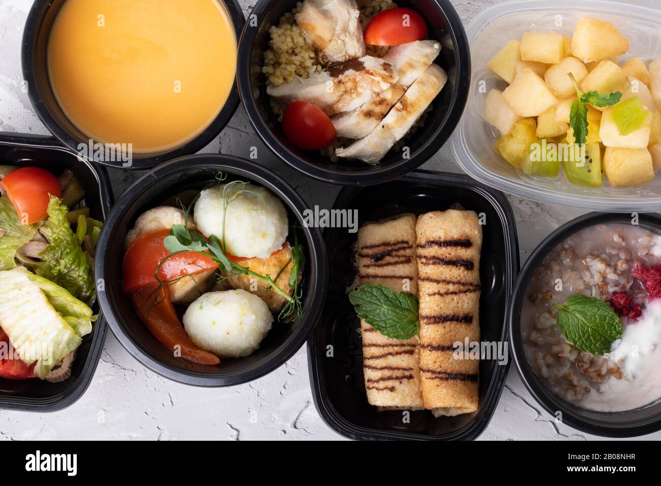 Meal prep of breakfast, lunch, and dinner in black containers for full ...