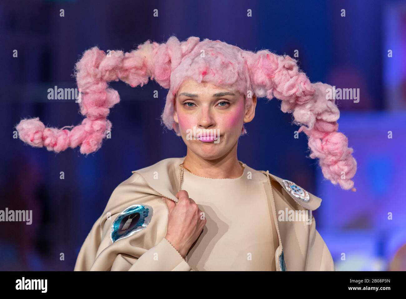 Vin and Omi London Fashion Week Resist AW20 show. Eco friendly clothing designed from plants and weeds from Highgrove estate. Woven into pink headgear Stock Photo