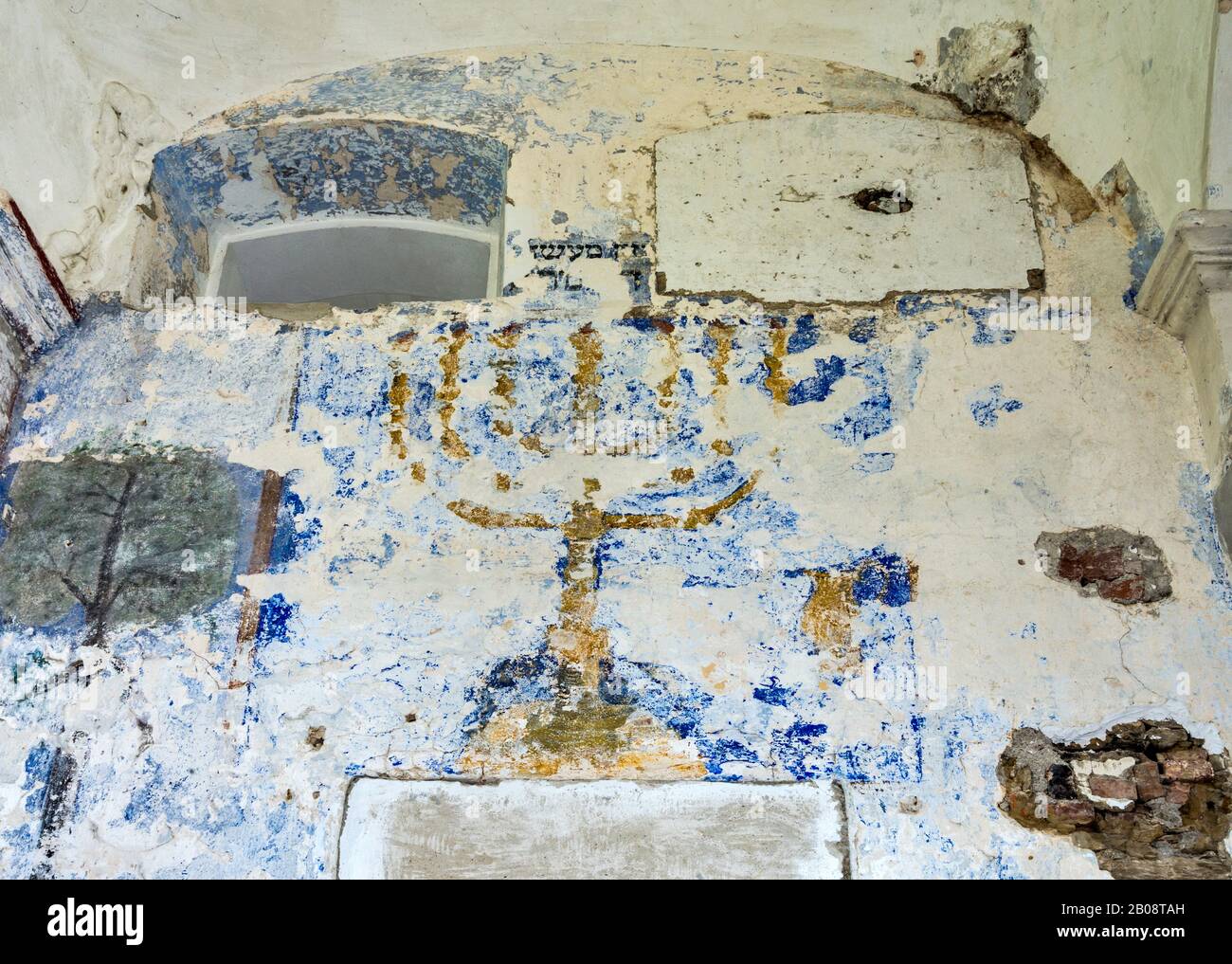 Damaged polychrome painting of menorah, Hebrew lampstand, at synagogue, 1756, in Bobowa, Beskidian Foothills, Western Carpathians, Malopolska, Poland Stock Photo