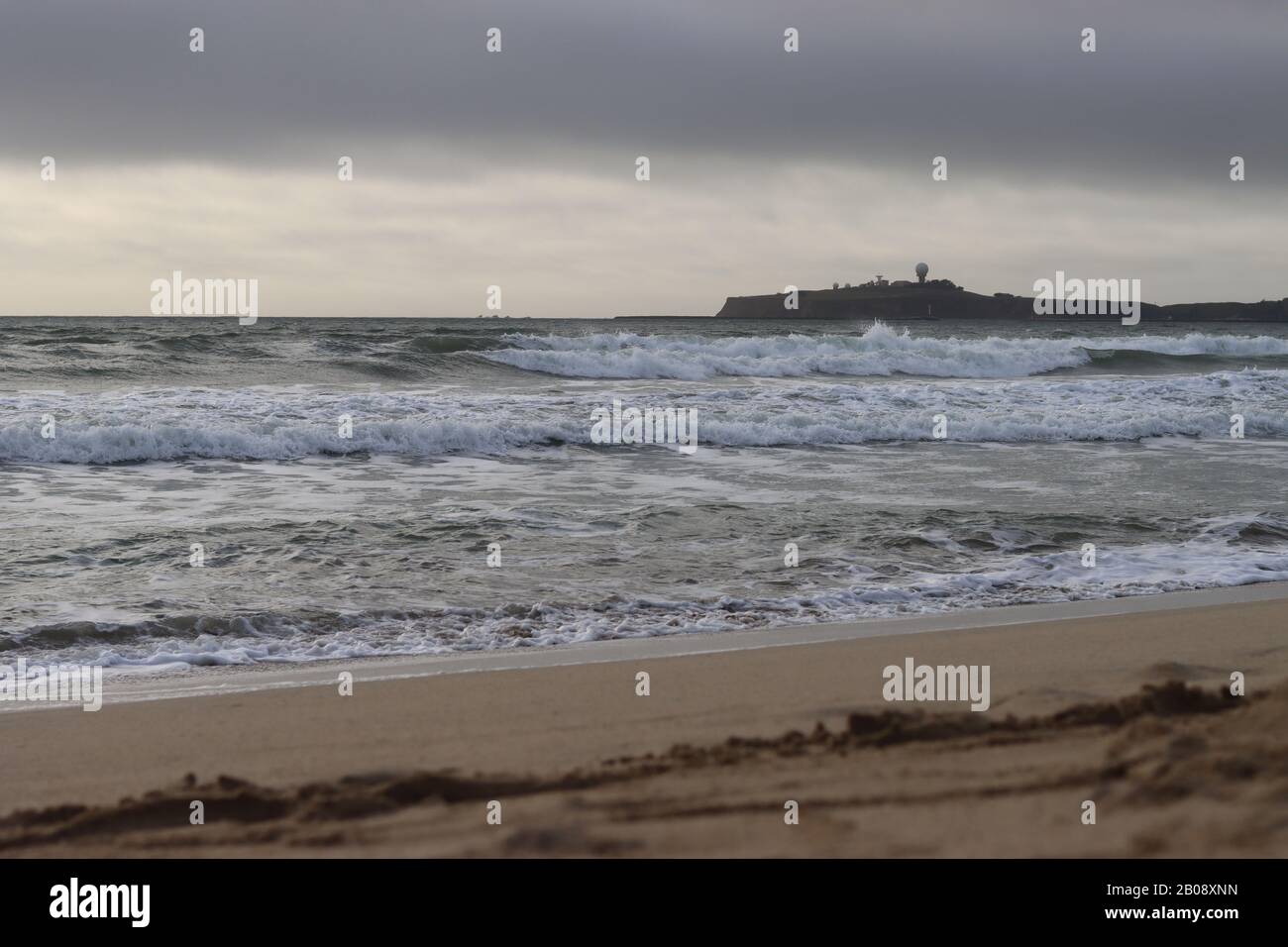 Beach shot of the waves and sand. Stock Photo