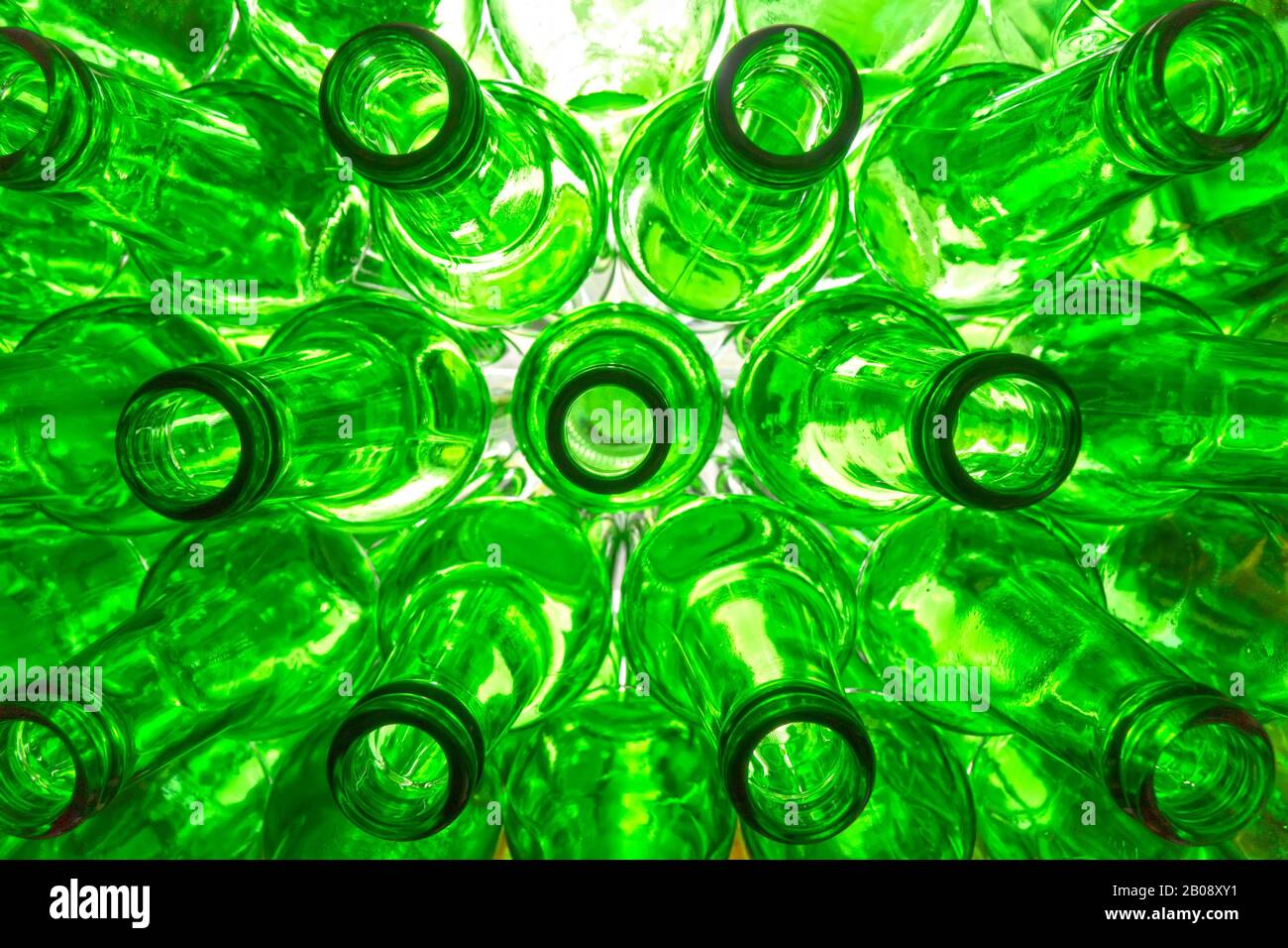 glass beer bottles lie in rows, necks on camera Stock Photo Alamy