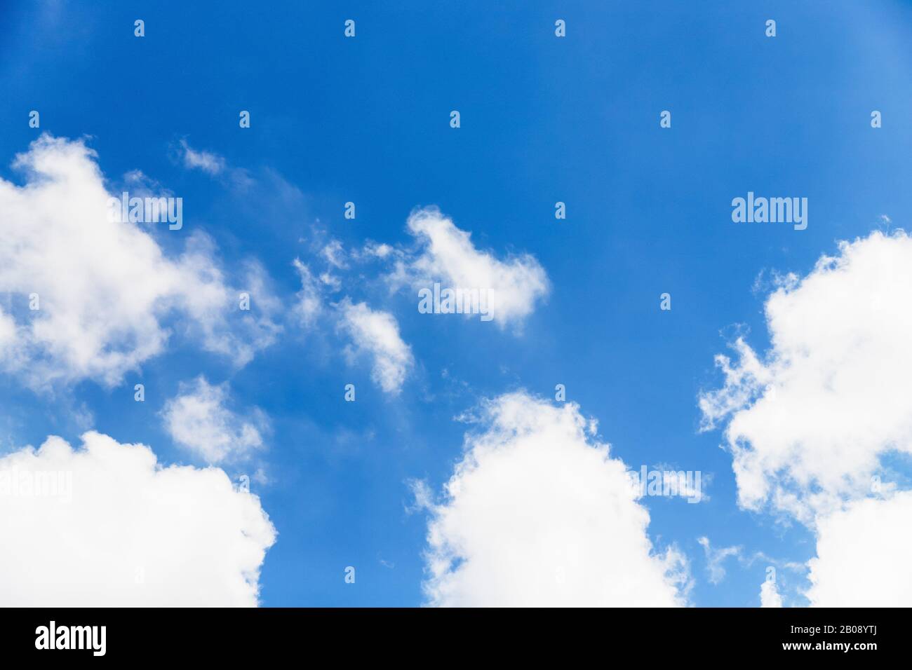 Blue sky background. Blue sky with fluffy white clouds. Copy space ...