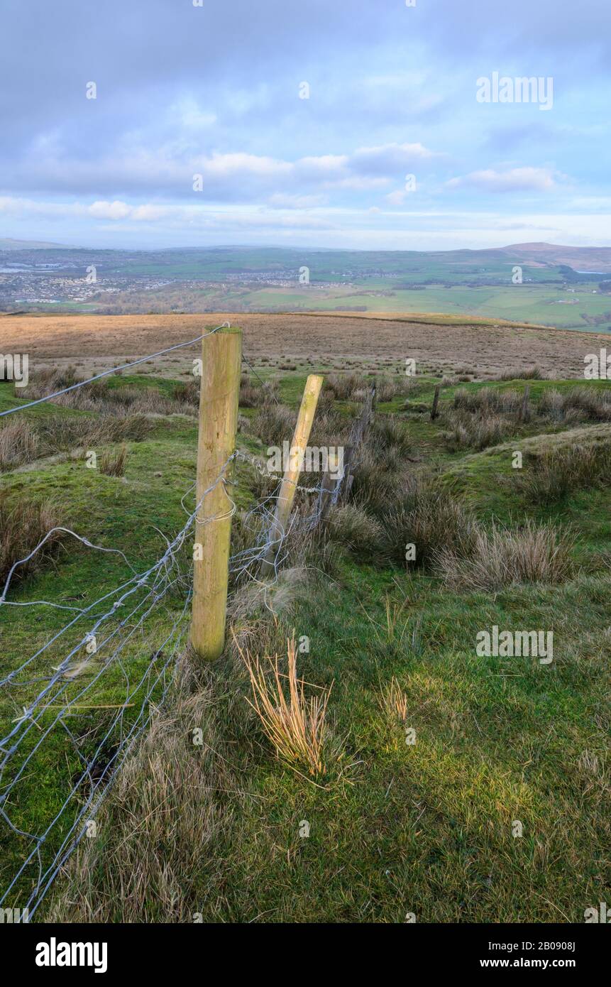 A wire fence on the moors along Crown Point Road overlooking Burnley, Lancashire, England, UK. Stock Photo