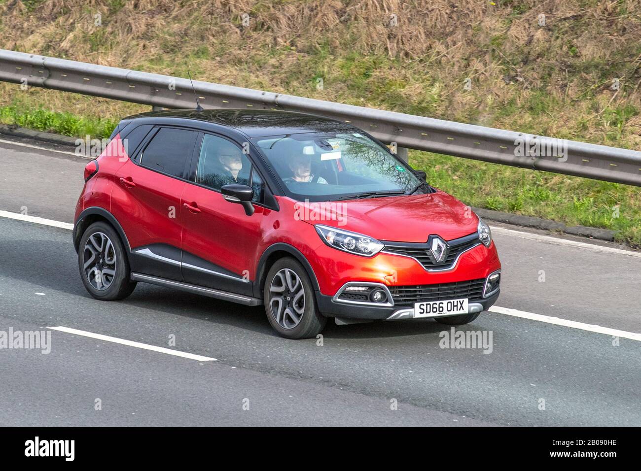 red Renault Captur NAV DCI; Vehicular traffic, road transport, modern vehicles, saloon cars, vehicle driving, roads & motors, motoring on the M61 motorway highway Stock Photo - Alamy