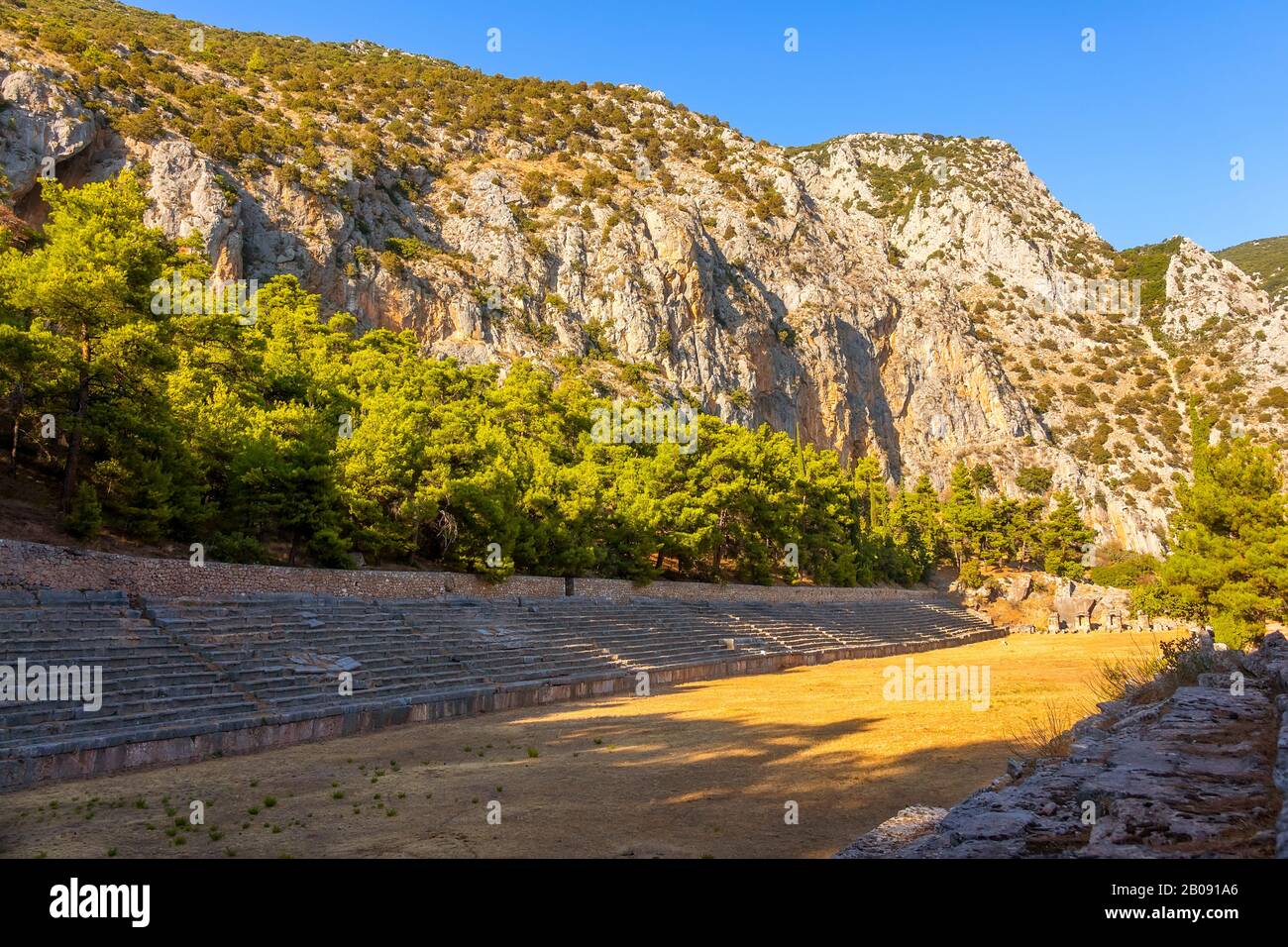 Greece. Delphi. A small ancient stadium at the foot of the mountain. Summer sunny day Stock Photo