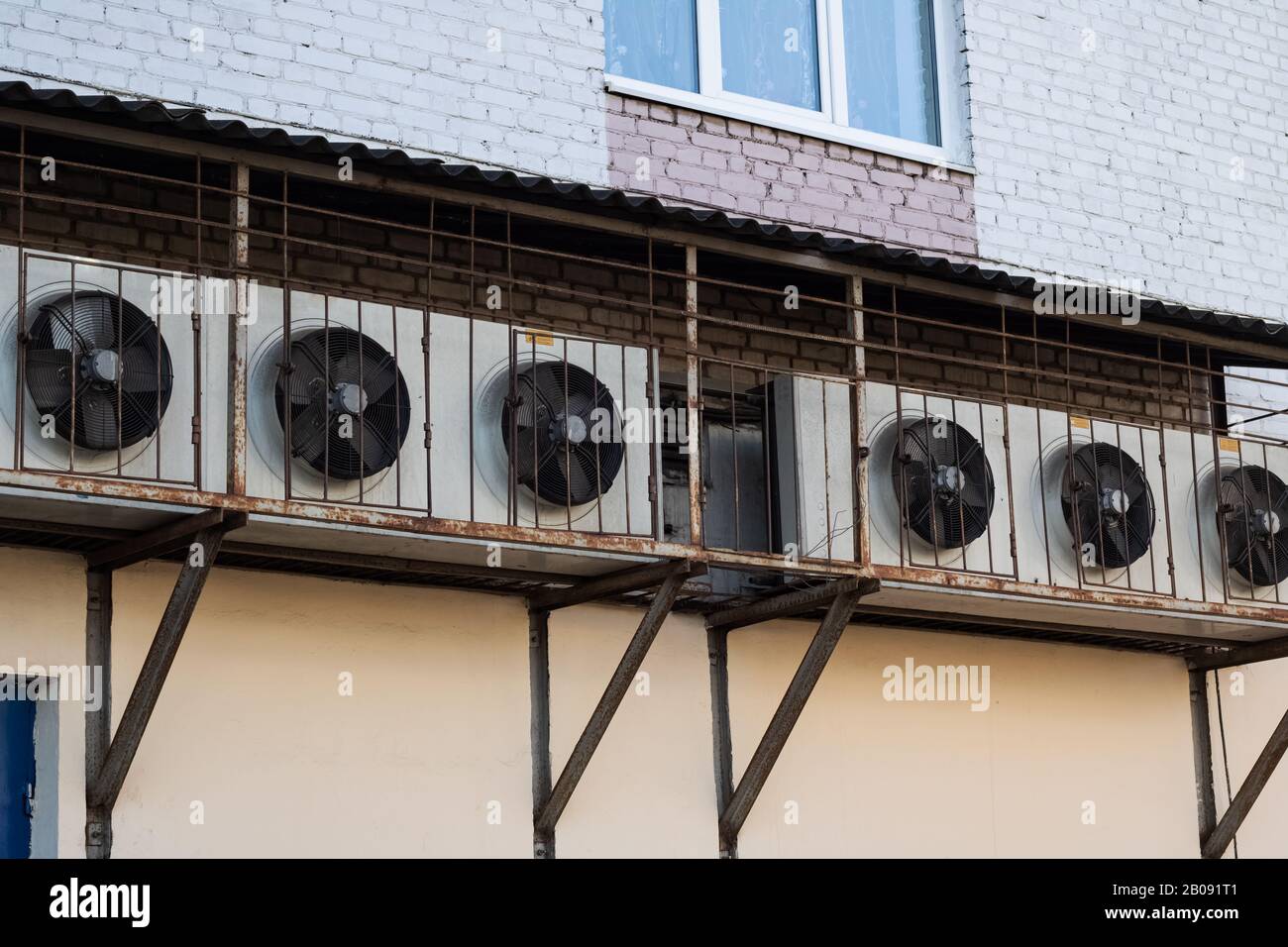 Conditioners in row on wall of house Stock Photo Alamy