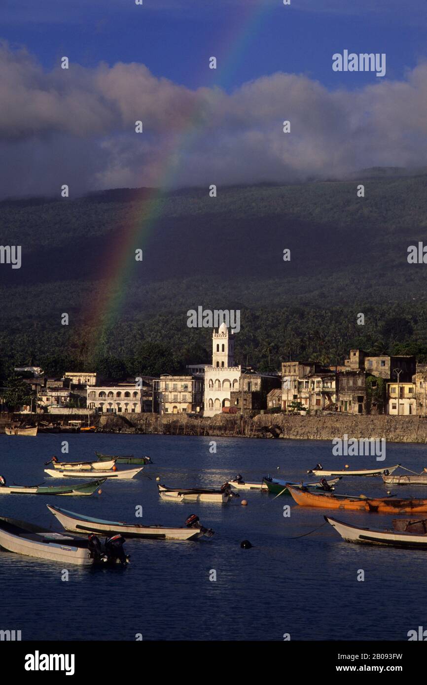 COMORO ISLANDS, GRAND COMORE, MORONI, VIEW OF TOWN WITH FISHING BOATS IN FOREGROUND, RAINBOW Stock Photo