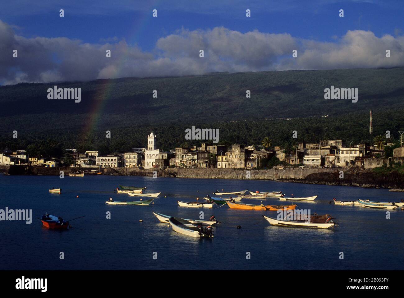 COMORO ISLANDS, GRAND COMORE, MORONI, VIEW OF TOWN WITH FISHING BOATS IN FOREGROUND, RAINBOW Stock Photo