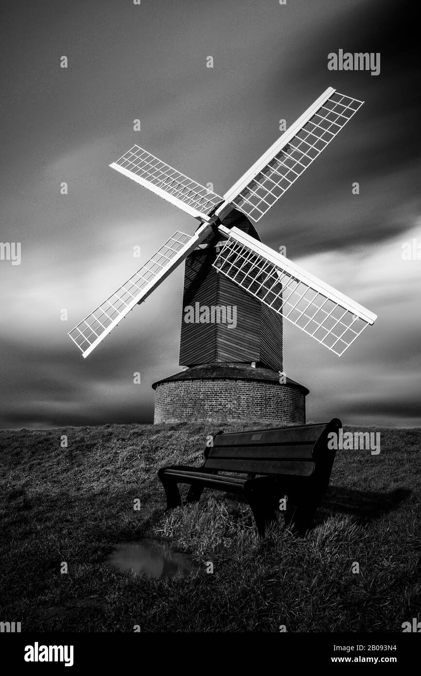 Brill Windmill: Old wood and brick windmill on a hilltop in the English countryside. Heritage site and popular tourist attraction. Stock Photo