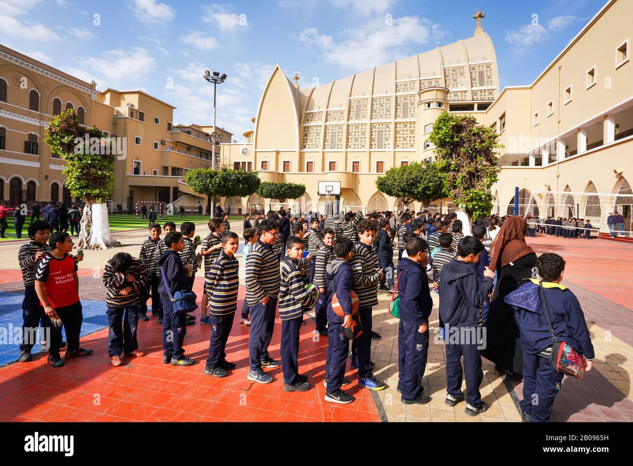 Schoolchildren in the schoolyard of the Catholic school Collège de La