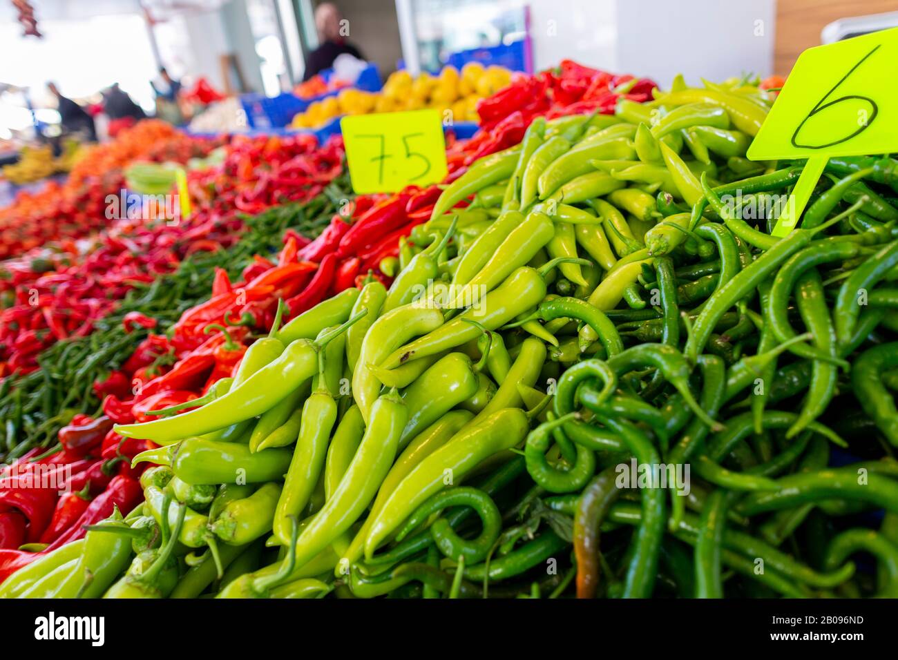 Delicious green and red peppers lies on a market Stock Photo - Alamy