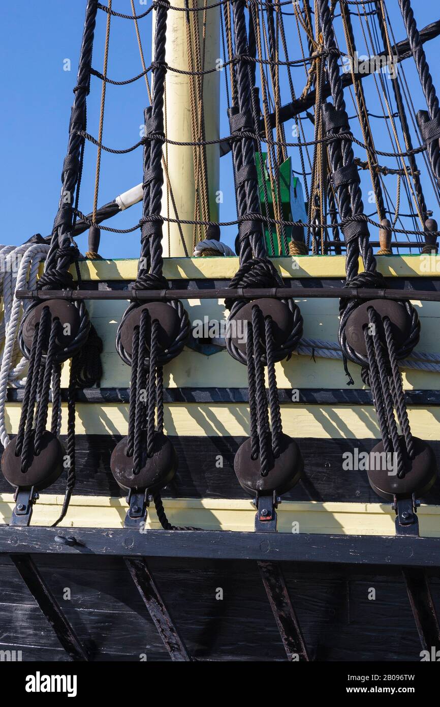 The Friendship of Salem Tall Ship (a replica of a 1797 East Indiaman ship) docked at Derby Wharf in Salem, Massachusetts USA. Derby Wharf is part of t Stock Photo