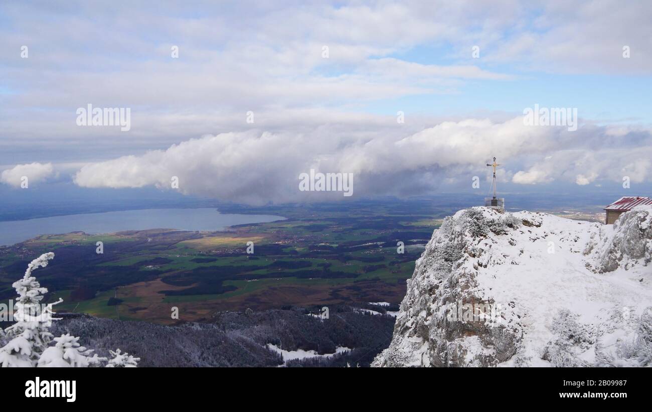 Hochfelln, Germany: Panorama from on the Chiemsee lake with the Hochfelln summit cross Stock Photo