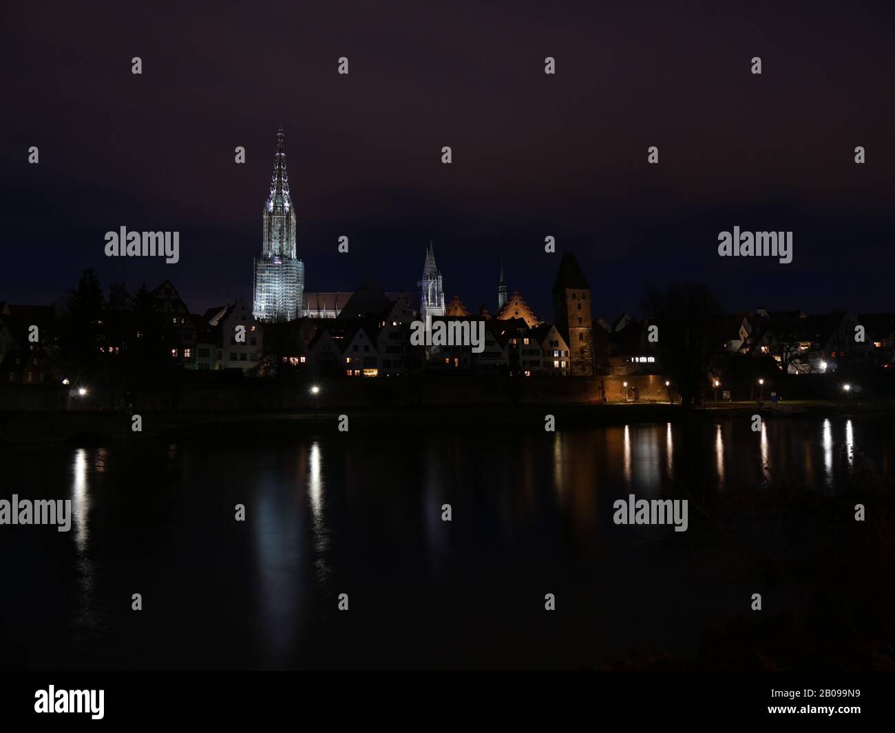 Ulm, Germany: The night skyline is reflected in the Donau Stock Photo