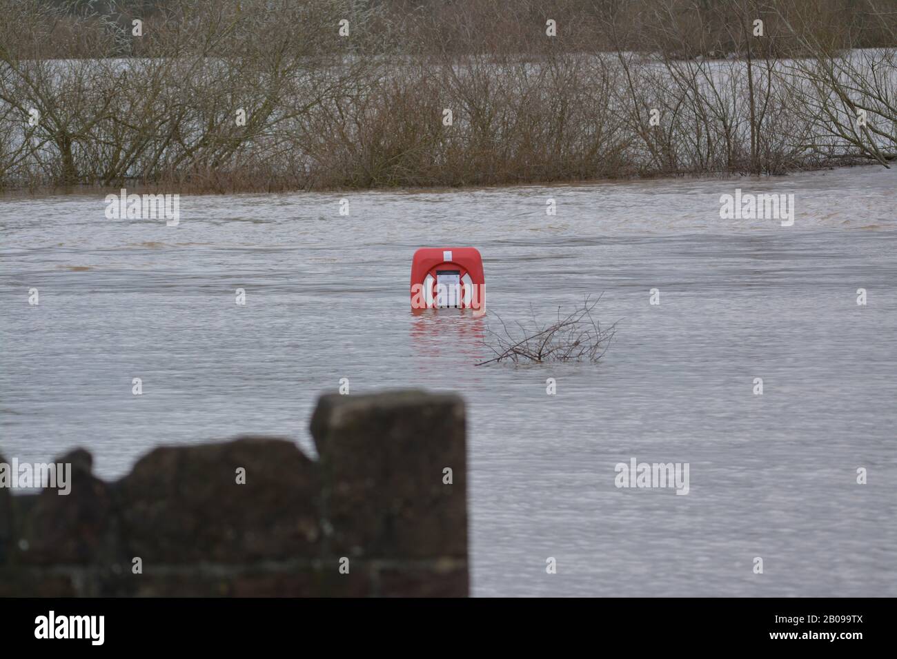 Flooded river bank around River Wye at Ross-on-Wye after river burst its banks following heavy rainfall re storms winter global change climate Stock Photo