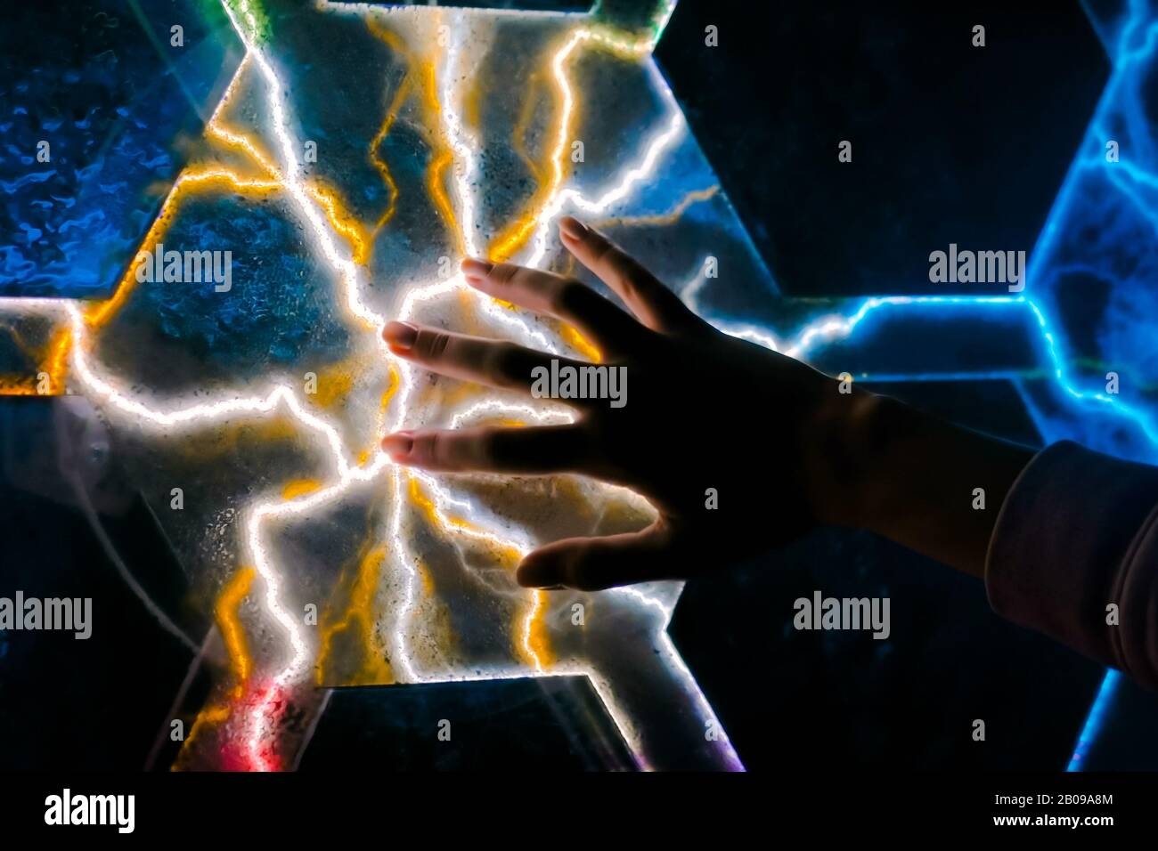 Woman touching plasma panel display Stock Photo