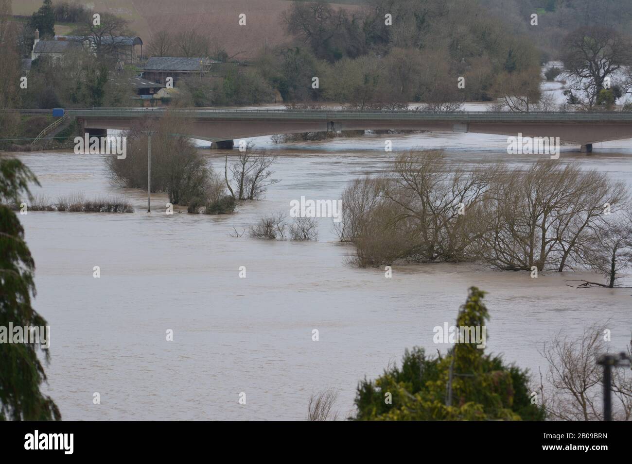 Flooded fields around River Wye at Ross-on-Wye after river burst its banks following heavy rainfall re storms winter global change climate Stock Photo