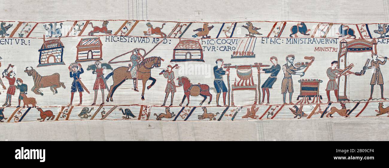 Bayeux Tapestry scene 41 - 42:  Cooks are supervised by Wadar, one of Williams servants. BYX41 - 42 Stock Photo