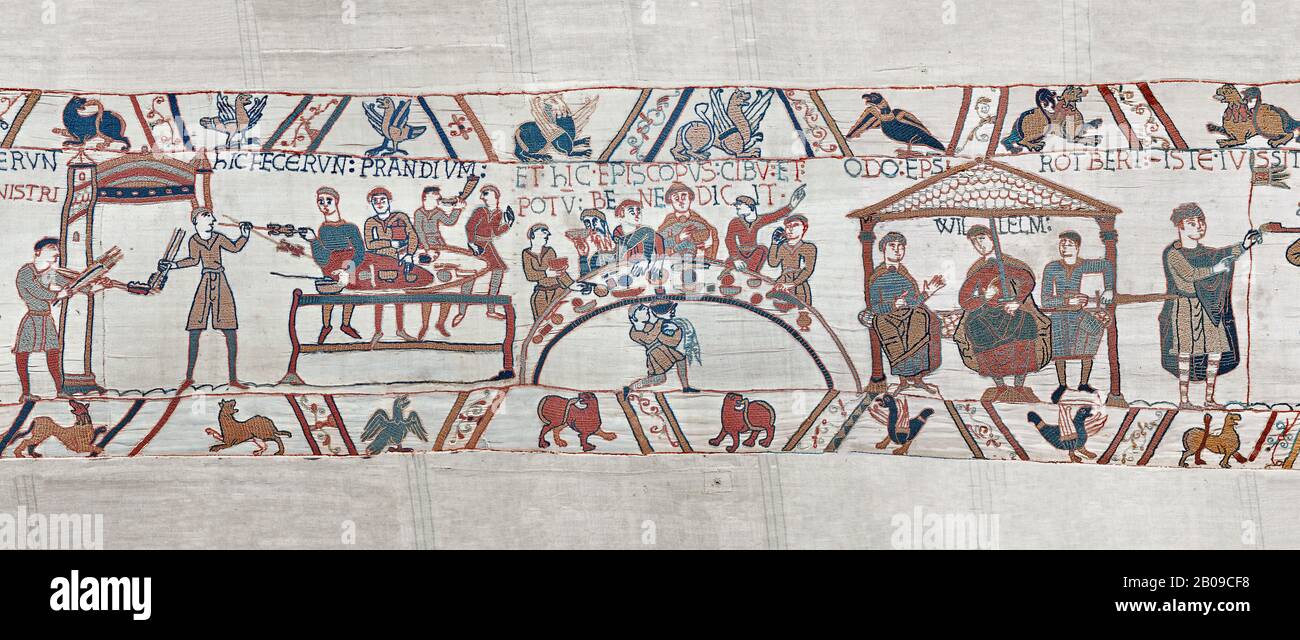 Bayeux Tapestry scene 43 - 44:  Duke William, his barons and Bishop Odo hold a banquet to celebrate their safe arrival in England. BYX43 BYX44 Stock Photo