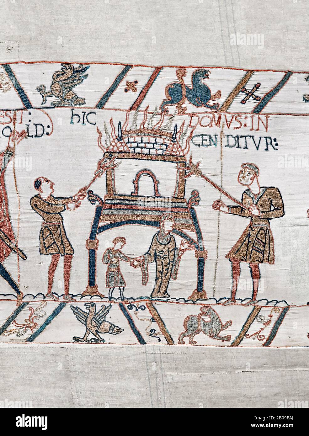 Bayeux Tapestry scene 46:  Duke William id told of Harolds army arrival and a house is burnt to clear the way. Stock Photo
