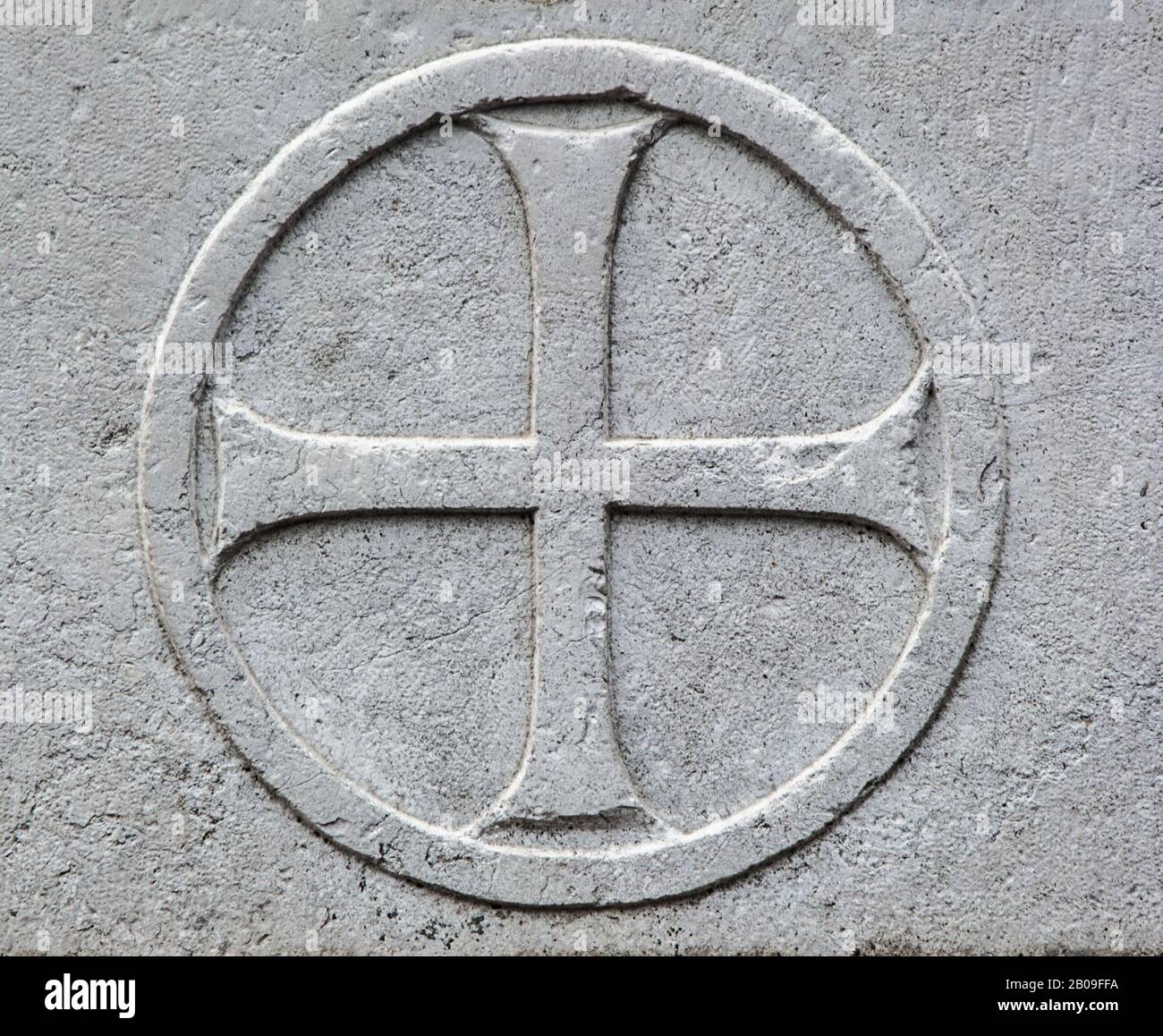 Cross in a circle, the image on the stone Stock Photo