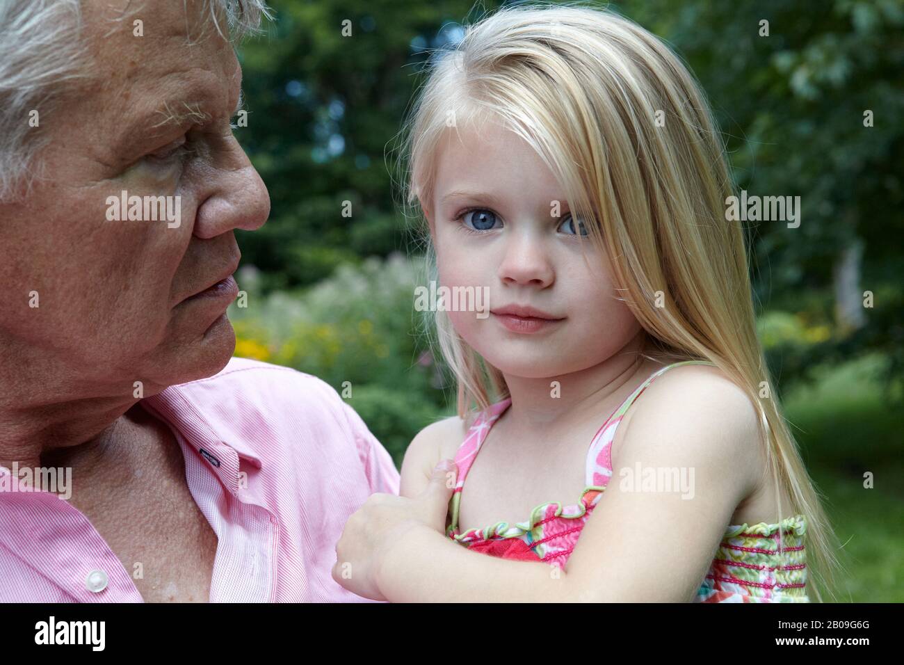 grandfather and beautiful toddler girl grandchild Stock Photo
