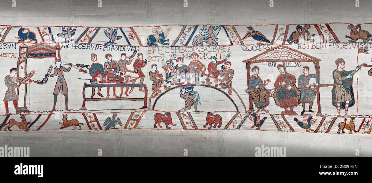 Bayeux Tapestry scene 43 - 44:  Duke William, his barons and Bishop Odo hold a banquet to celebrate their safe arrival in England. Stock Photo
