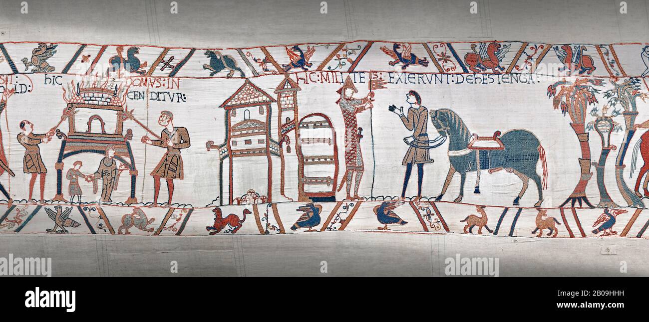 Bayeux Tapestry scene 47:  A house is burnt to clear the way for Williams Army and Duke William gets ready from battle. Stock Photo